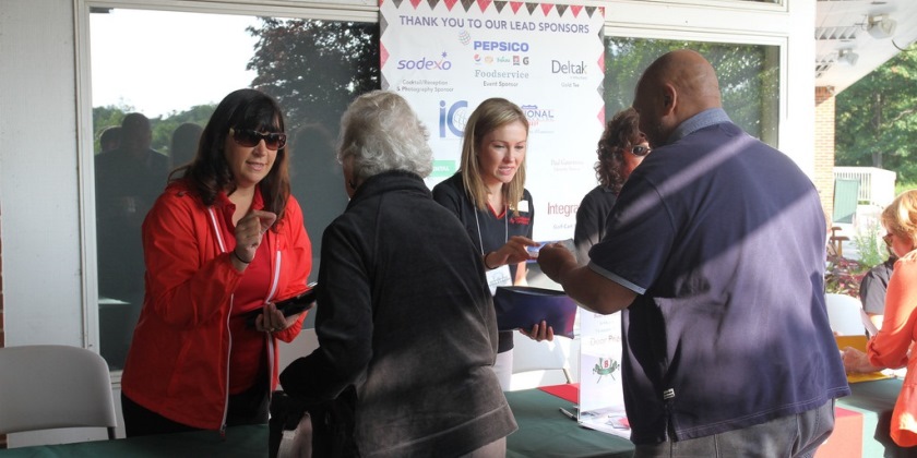 People checking in at an event