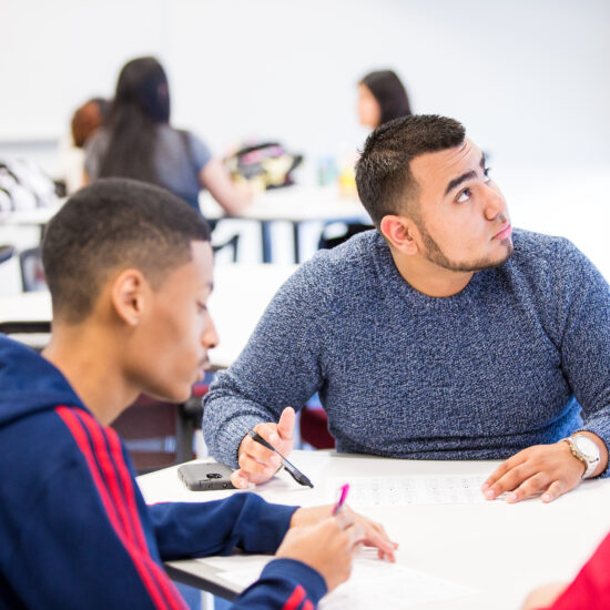 group of male Benedictine students working together in Mesa