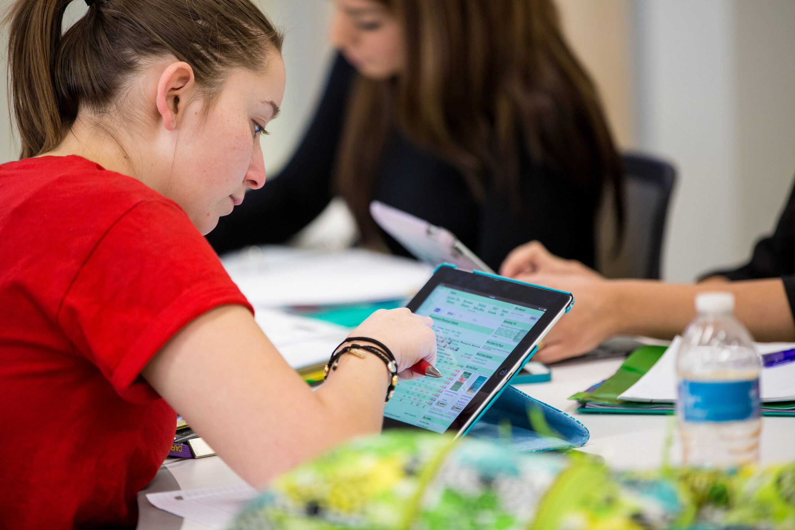 female student working on an iPad