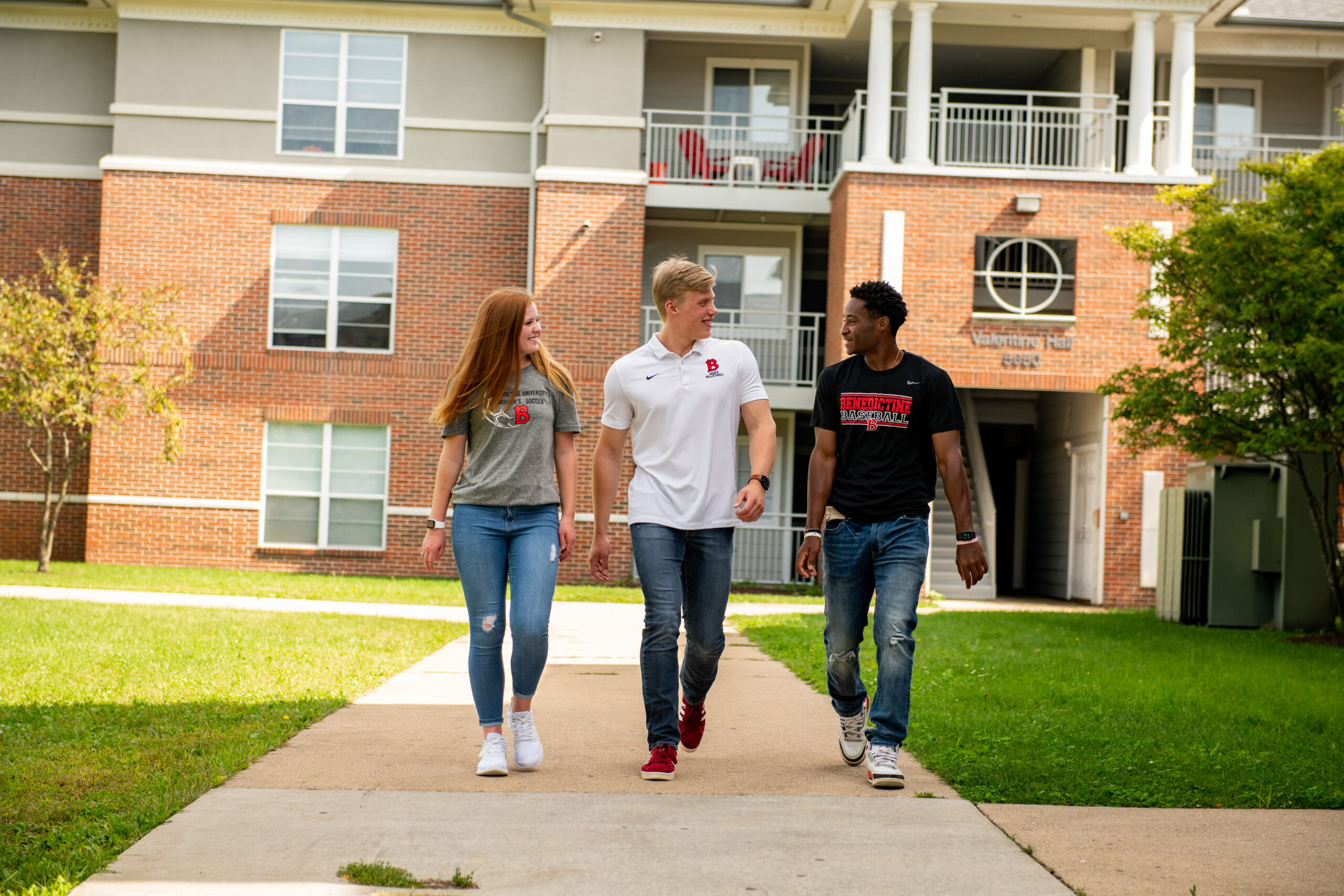 Students walking in front of Founders Woods