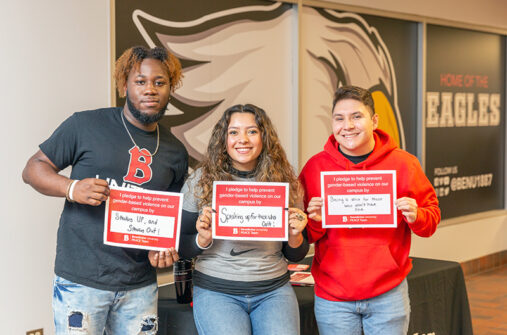 Students holding signs in support of violence prevention