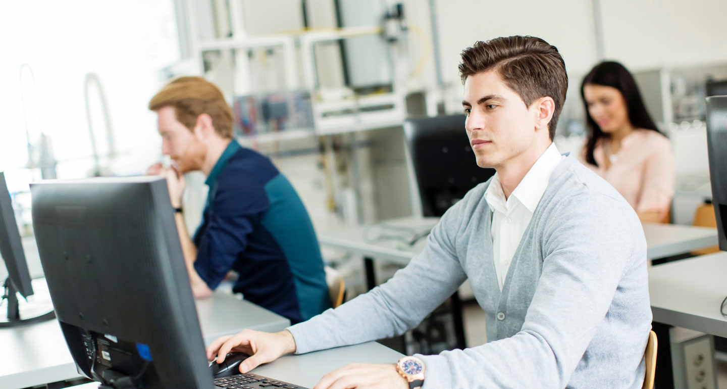 business and economics students at computers