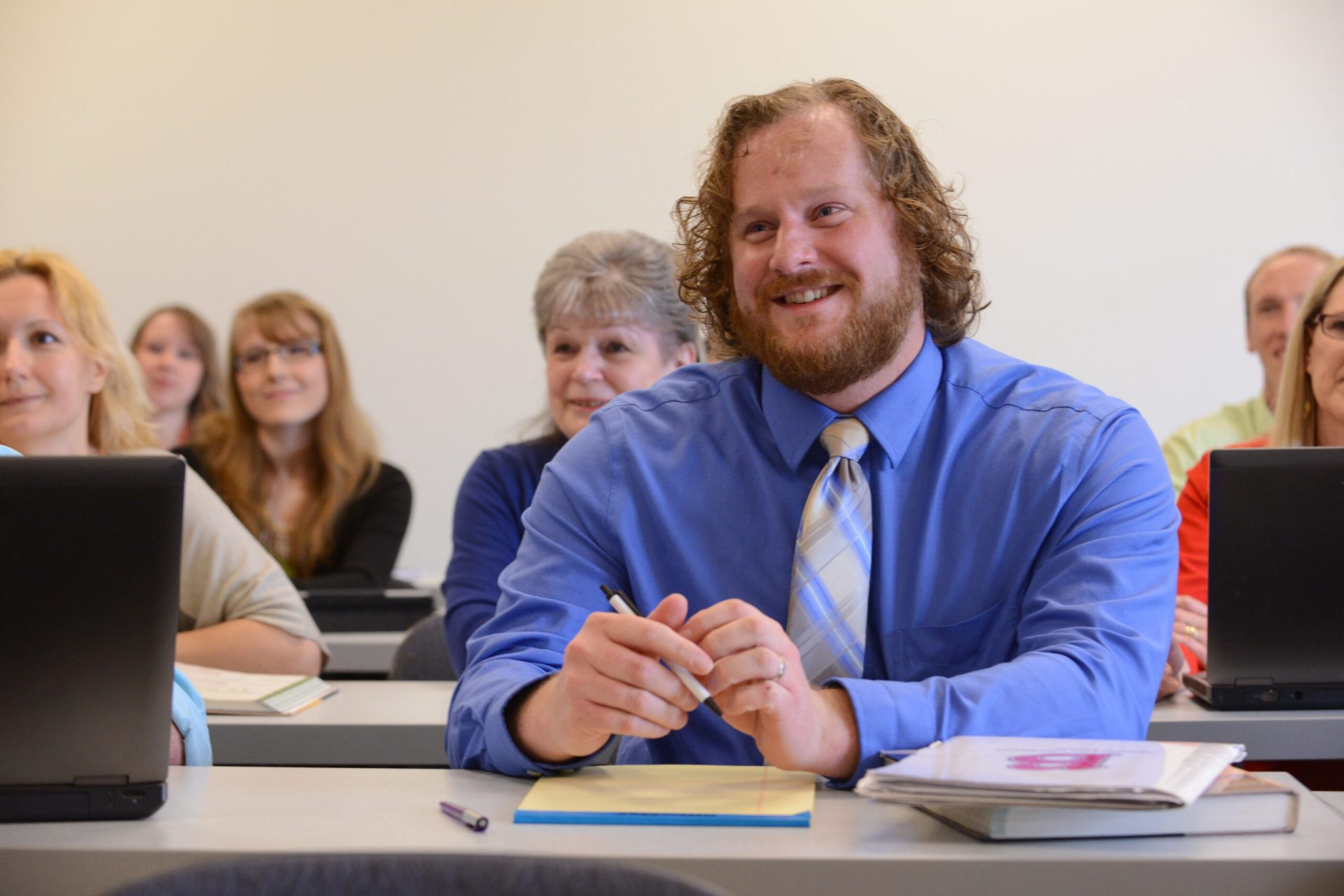 Adult male in classroom, portrait, professional