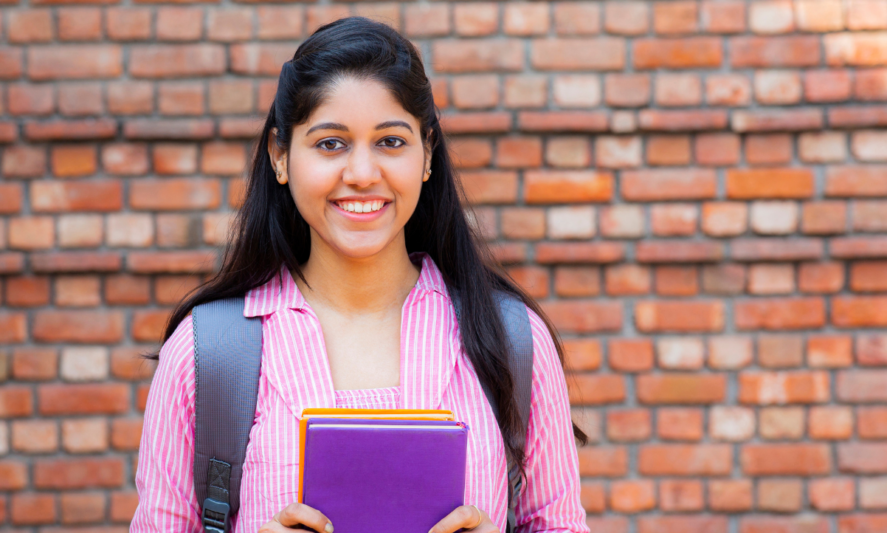 female students holding books