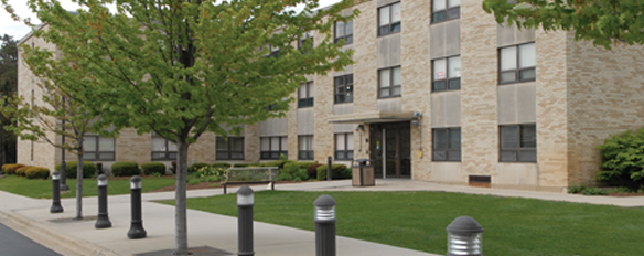 view from the street of Ondrak Hall with trees in front of building. Admitted Freshmen