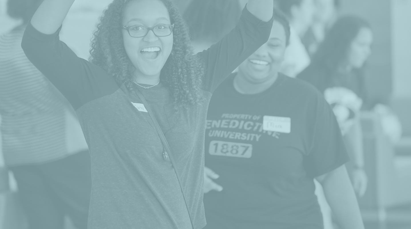 Female student cheering with arms above her head - financial aid scholarships
