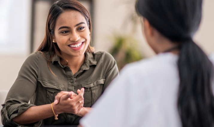 female counselor talking with female student; clinical psychology