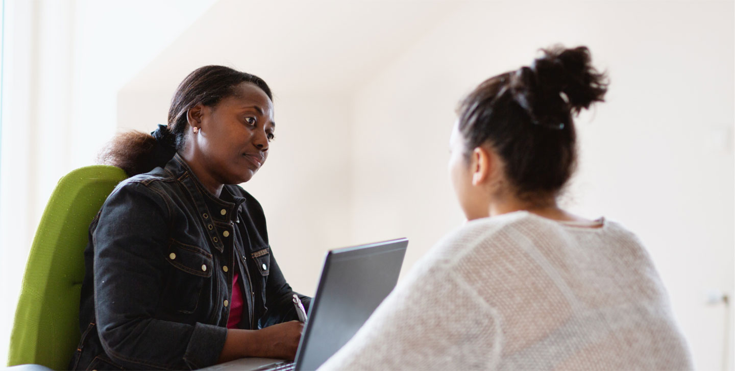 two African American females having a conversation; social work minor