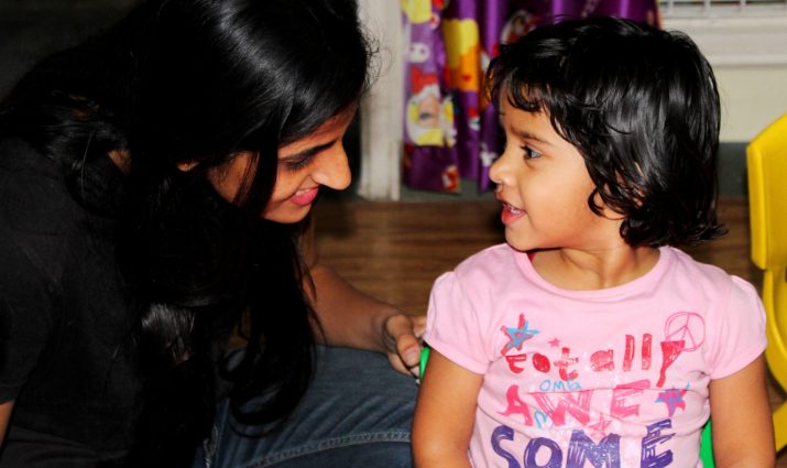 elementary education teacher with child