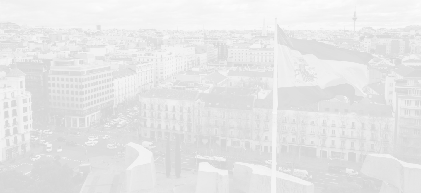 aerial view of Spanish city, image has heavy white overlay; Spanish program