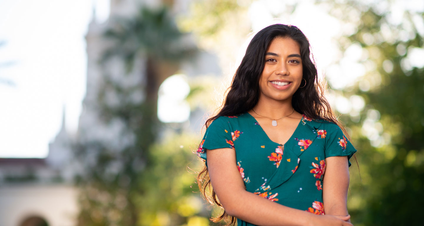 headshot of female student smiling outside; out of state award
