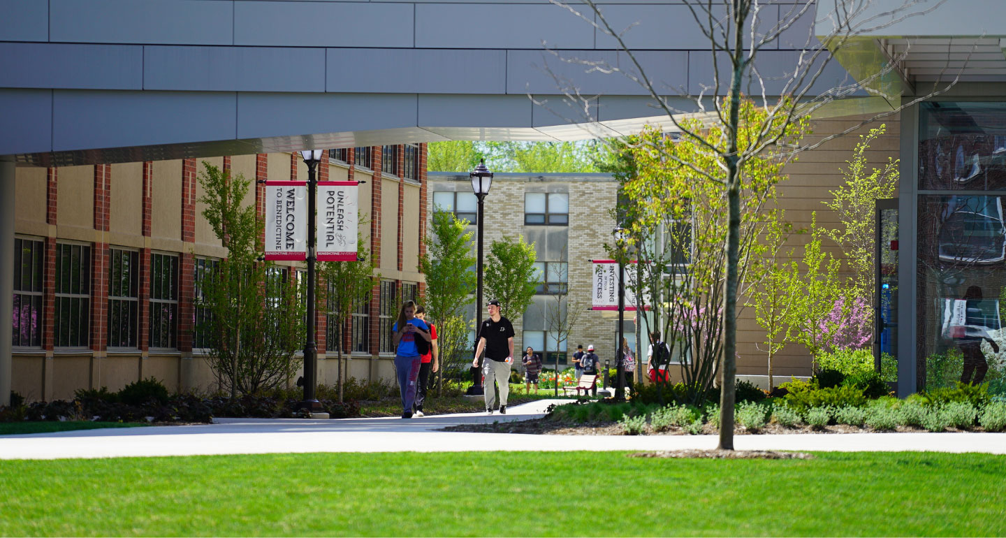 photo of students walking under bridge between Kindlon and Goodwin; Facilities management