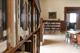 photo down the side of a bookshelf in the library; archives