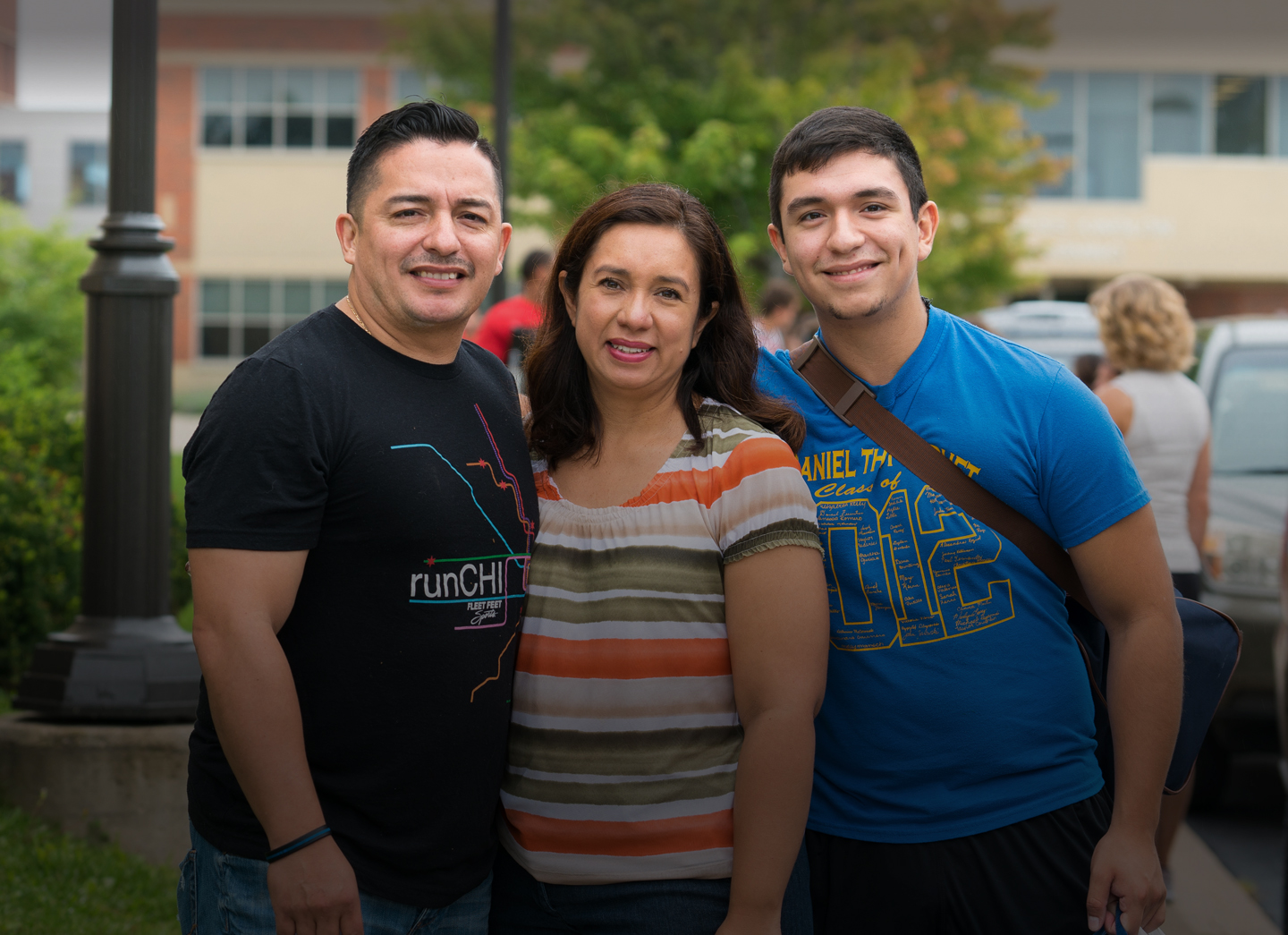 freshman student with his parents on move in day on Lisle campus; parent and family engagement