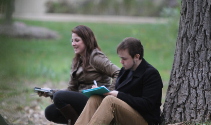ecology class, students studying outside