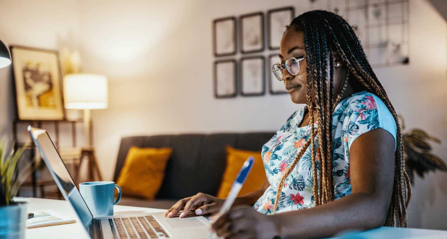 Degrees and Programs hero image. Female student studying at home on her laptop