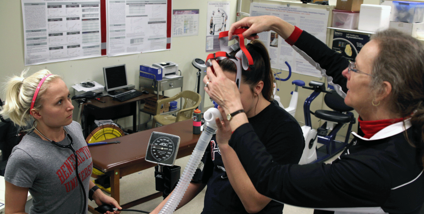 Exercise physiology lab, getting students into a mask for testing