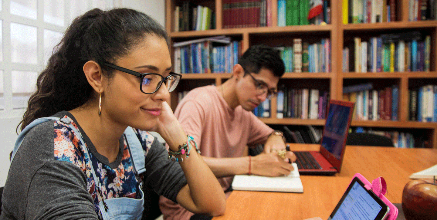 Political Science students at table in the library