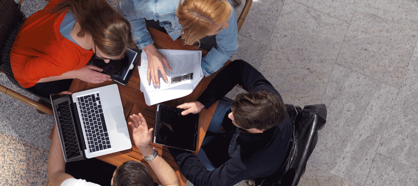 photo looking down on group of Mathematics students studying
