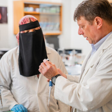 Dr. Fackenthal with student in lab